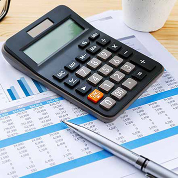 Financial chart with calculator and pen